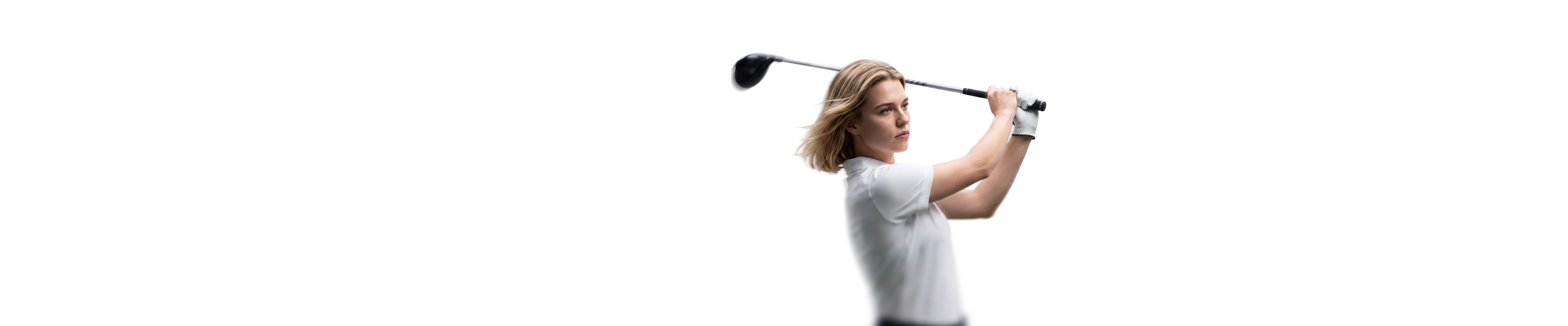 female golfer completing a golf swing